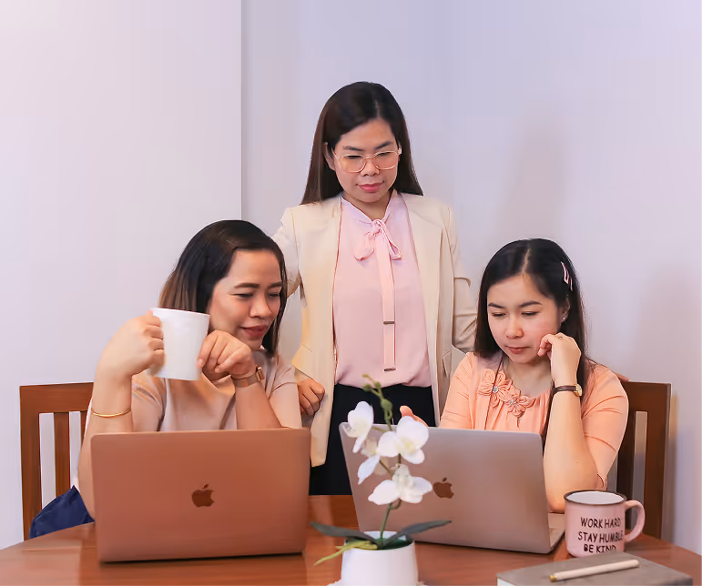 Yoonet management team collaborating at a table
